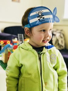 My little lad Fred being a pirate and demanding Lego and cushion constructions.